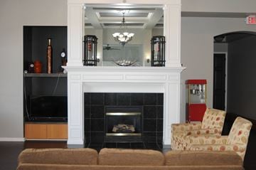 Hebron apartment for rent - A living room with a fireplace and a chair.