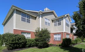 Alexandria apartment for rent - A house with a grey roof and red brick pillars.