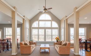 Ft Mitchell apartment for rent - A living room with a large window and a ceiling fan.