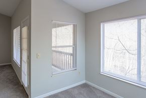 Ft Mitchell apartment for rent - A room with two windows covered in white blinds.