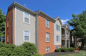Burlington apartment for rent - A red brick building with a grey roof and white windows.
