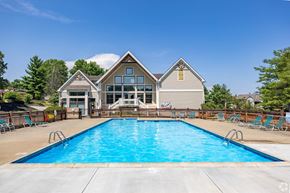 Burlington apartment for rent - A large house with a pool in front.