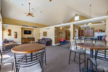 Burlington apartment for rent - A living room with a brown table surrounded by chairs.