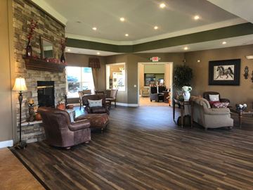Richwood apartment for rent - A living room with a fireplace and a chair.