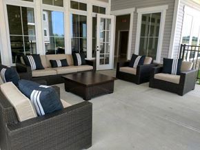 Union apartment for rent - A patio with a couch, chairs, and a coffee table.