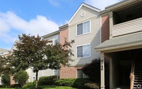 Cincinnati apartment for rent - A tree is in front of a building with the number 67740 on the front door.