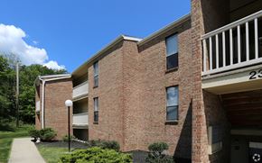 Crescent Springs apartment for rent - A red brick building with a balcony on the right side.