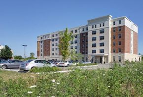 Waukegan apartment for rent - a large building with cars parked in front of it
