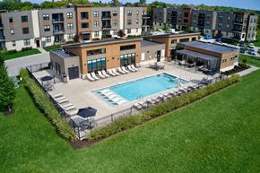 Franklin apartment for rent - an aerial view of a pool with chairs and a building at Statesman Apartments, Franklin, 53132