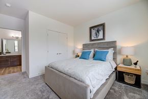 Franklin apartment for rent - a bedroom with a large bed and a closet at Statesman Apartments, Wisconsin 53132
