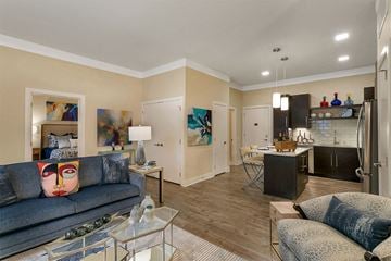 Beachwood apartment for rent - A living room with a grey couch and a glass coffee table.