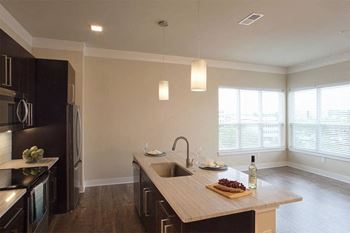 A kitchen with a sink and a counter top