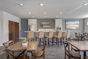 Cozy clubroom with fireplace and kitchen area