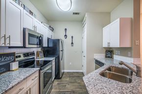 Charlotte apartment for rent - Granite Counter Tops In Kitchen at Parkside at South Tryon, Charlotte, North Carolina