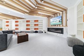 Brooklyn apartment for rent - A modern living room with a fireplace and a television.