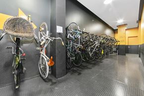 Brooklyn apartment for rent - a row of bikes parked in a parking garage