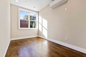 Brooklyn apartment for rent - A room with a window and wooden floors.