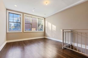 Brooklyn apartment for rent - A room with a window and a railing.