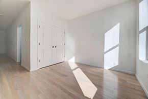 Brooklyn apartment for rent - an empty living room with white walls and wood floors
