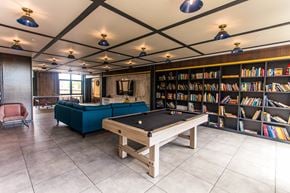 Brooklyn apartment for rent - A room with a pool table and a bookshelf.
