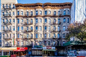 New York apartment for rent - a large apartment building on a city street