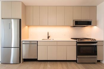 Microwave with concealed touch panels