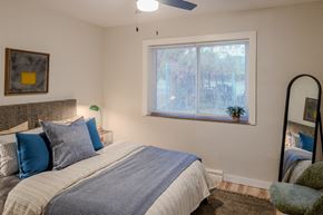 St. Louis apartment for rent - a bedroom with a large bed and a window