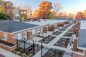 St. Louis apartment for rent - an aerial view of a community garden with brick buildings