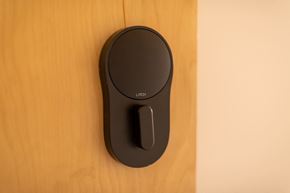 St. Louis apartment for rent - a wireless mouse plugged into a wooden door