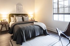 Saint Louis apartment for rent - a bedroom with a bed and two windows