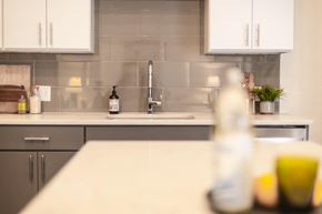 Saint Louis apartment for rent - a white counter top in a kitchen with a sink