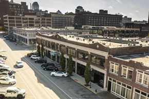 Saint Louis apartment for rent - an aerial view of a city street with cars and buildings