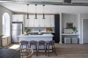 St. Louis apartment for rent - a kitchen with white cabinets and a white counter top