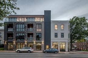 St. Louis apartment for rent - the exterior of a building with cars parked in front of it