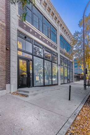 St. Louis apartment for rent - A building with a brick facade and large windows.
