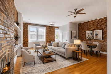 Saint Louis apartment for rent - A living room with a brick wall and a fireplace.