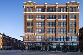 St Louis apartment for rent - a tall brick building on a city street at The Draper, St Louis, 63103