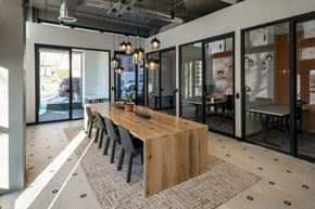 St Louis apartment for rent - a dining room with a wooden table and chairs at The Draper, St Louis
