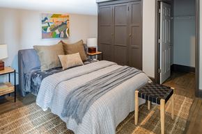 St. Louis apartment for rent - a bedroom with a bed and a blue and white comforter