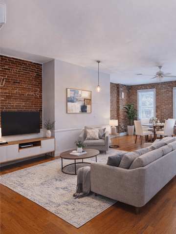 Saint Louis apartment for rent - A living room with a grey couch and a coffee table.