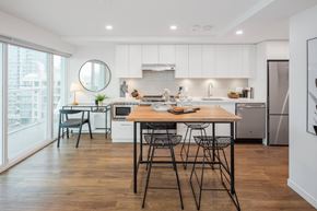 North Vancouver apartment for rent - A modern kitchen with a dining table and chairs.