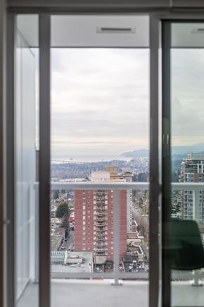 North Vancouver apartment for rent - A view of a cityscape through a window.