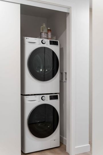 Vancouver apartment for rent - Two white front loading washing machines in a small laundry room.