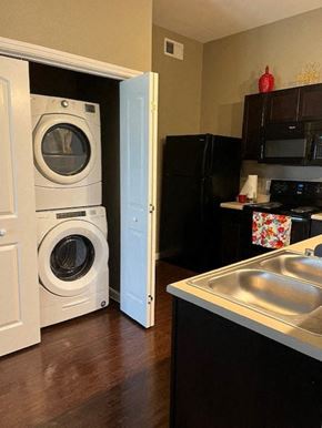 Thackerville apartment for rent - a kitchen with a washing machine and a sink