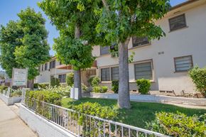Sherman Oaks apartment for rent - an apartment building with a yard and trees in front of it