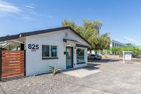 Phoenix apartment for rent - a small white building with a black roof and a blue door