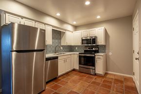 Phoenix apartment for rent - a kitchen with stainless steel appliances and white cabinets