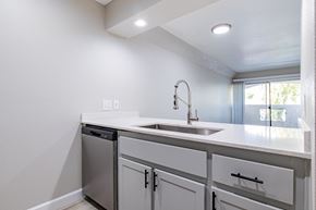 Tempe apartment for rent - A white kitchen with a sink and a dishwasher at Sofia Apartments, Tempe, 85283