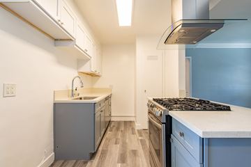 Sherman Oaks apartment for rent - A kitchen with a stove top oven and a sink.