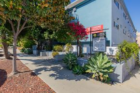 Santa Monica apartment for rent - a sidewalk in front of a building with a sign on it